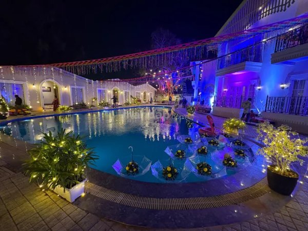 Illuminated Swimming Pool Deck at Night Divine Greenland